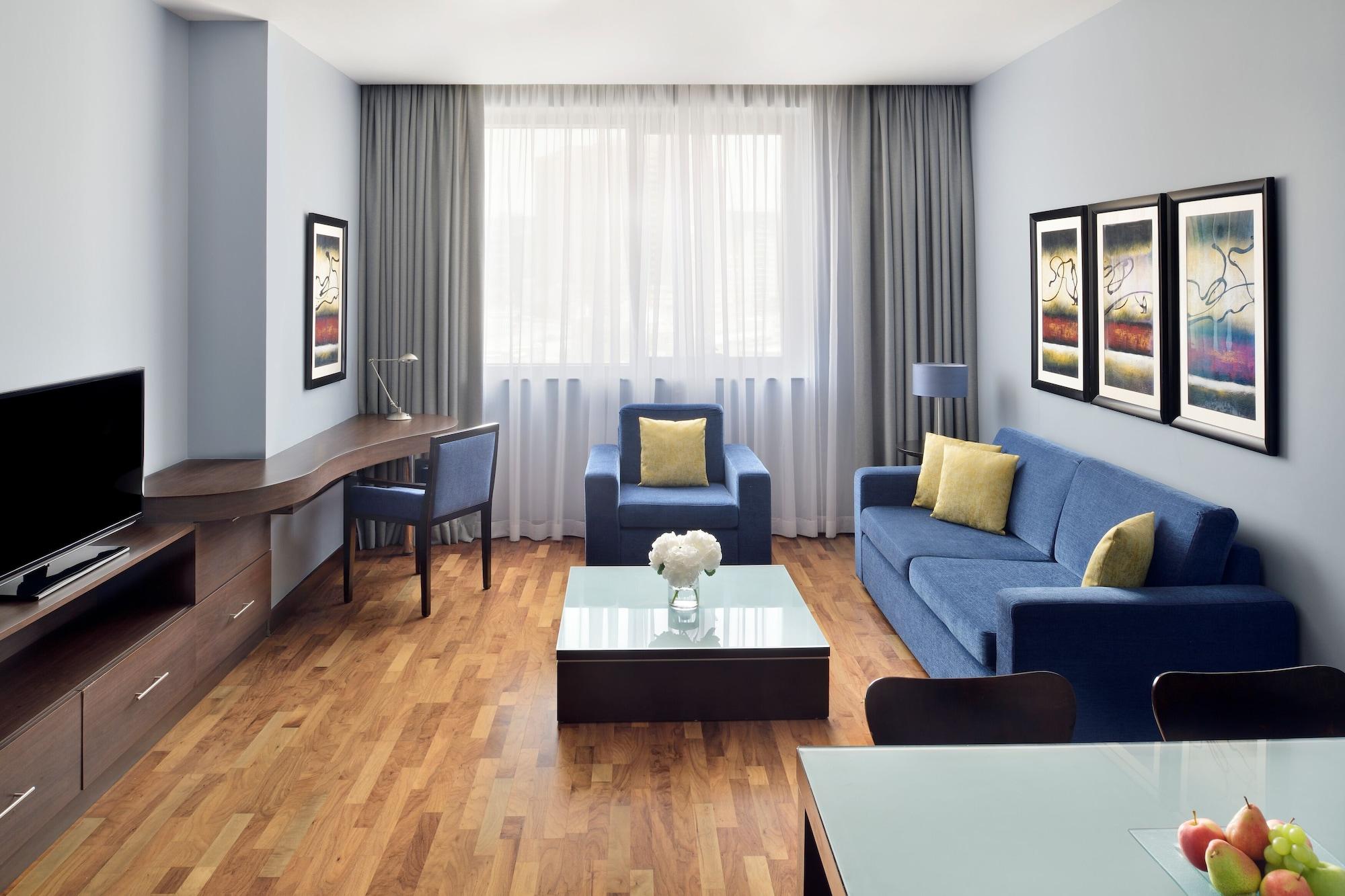 Moevenpick Hotel Apartments Al Mamzar Dubai Exterior foto A typical living room