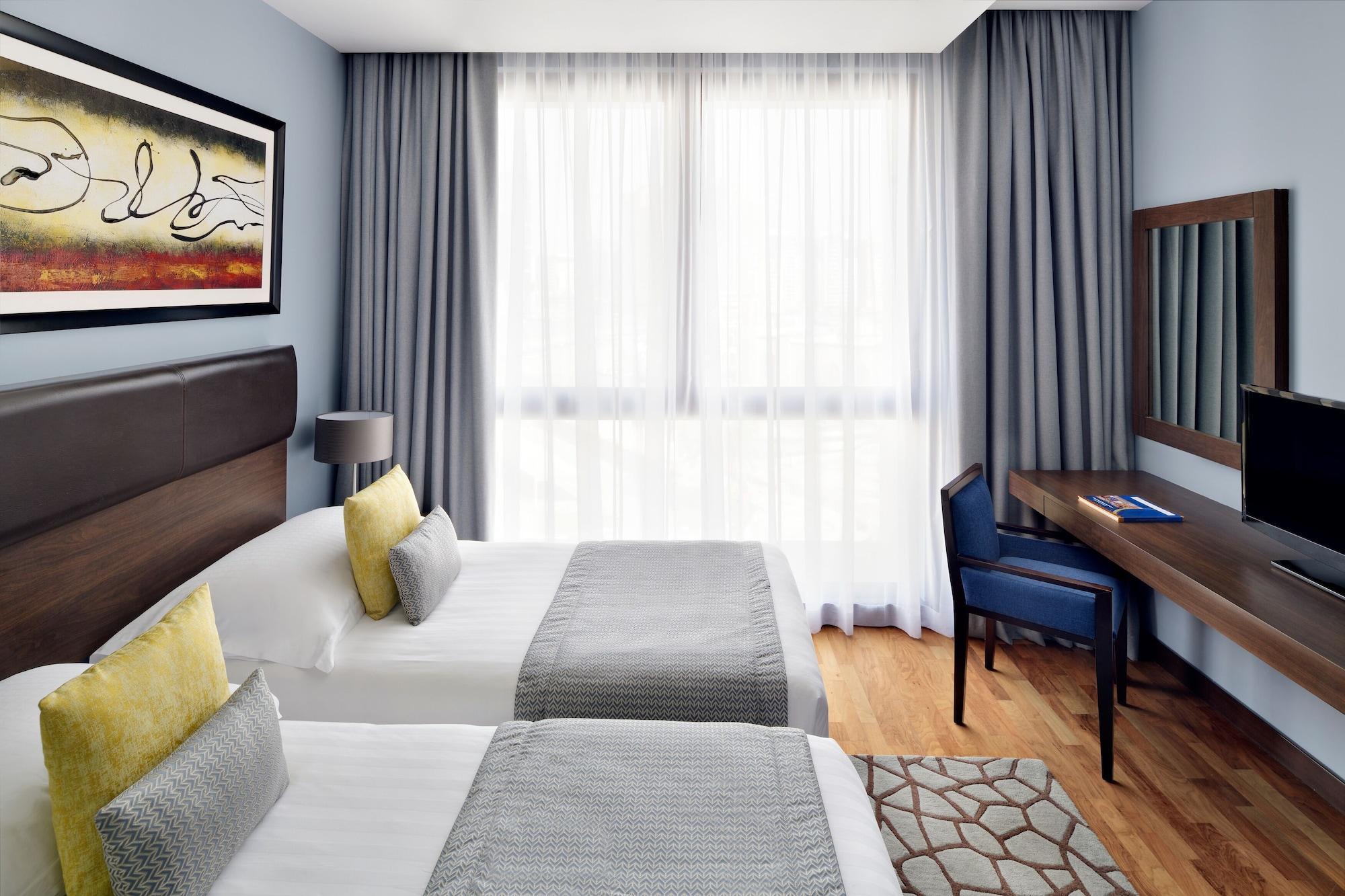 Moevenpick Hotel Apartments Al Mamzar Dubai Exterior foto A room at the hotel