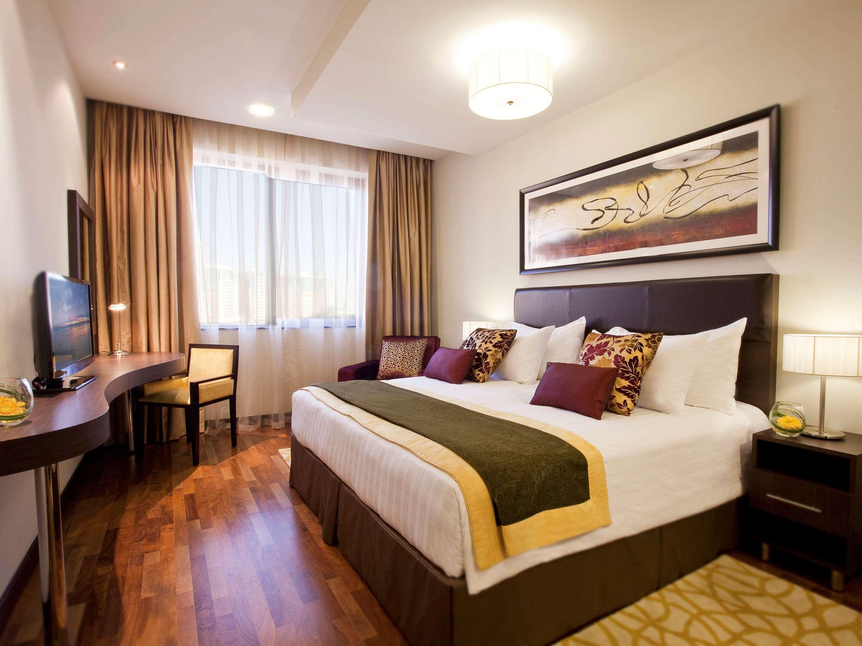 Moevenpick Hotel Apartments Al Mamzar Dubai Exterior foto A bedroom at the hotel