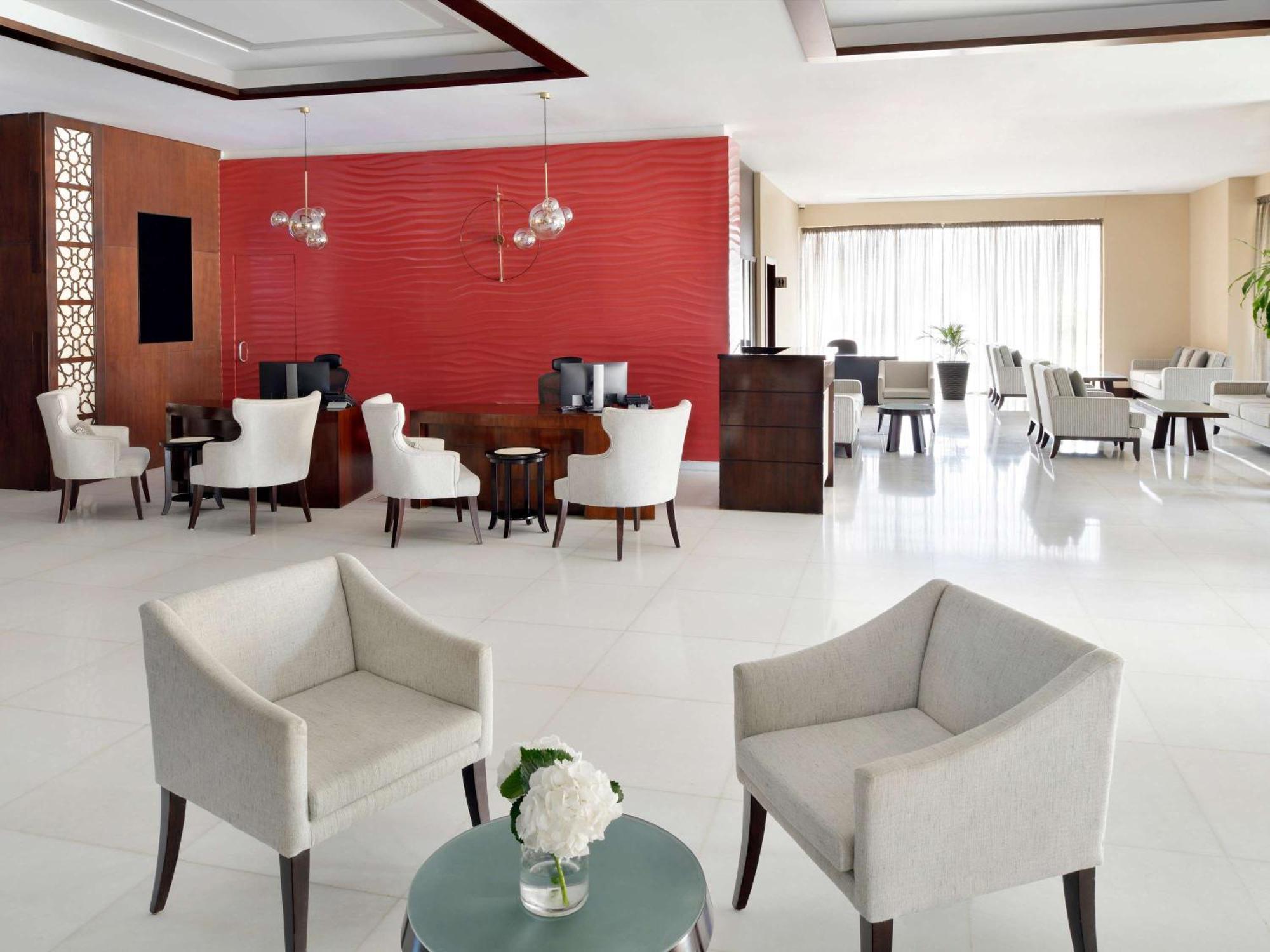 Moevenpick Hotel Apartments Al Mamzar Dubai Exterior foto Lobby