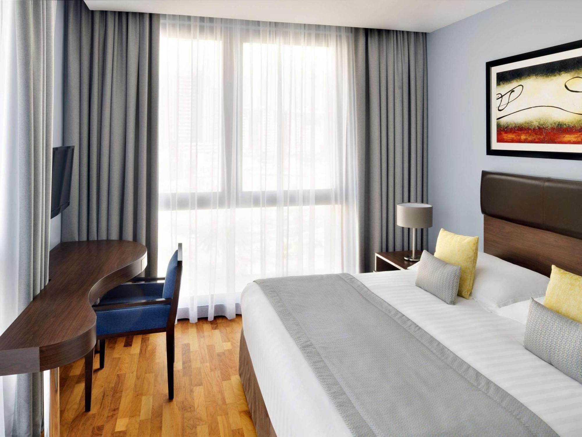 Moevenpick Hotel Apartments Al Mamzar Dubai Exterior foto A typical room at the hotel